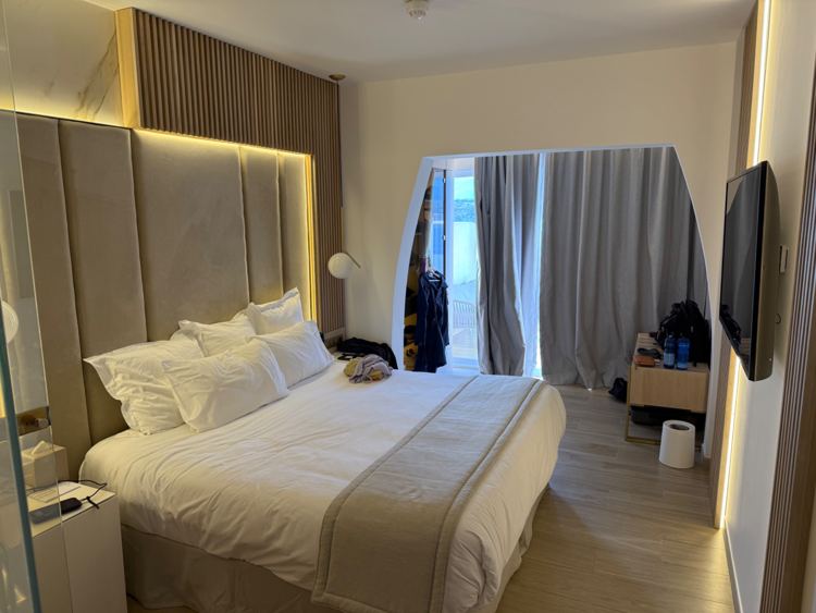The bedroom at Casadelmar, with terrace doors beyond the bed
