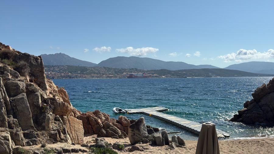 Clear blue water and rocky shoreline at Casadelmar